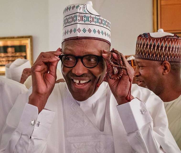 President Muhammadu Buhari happy