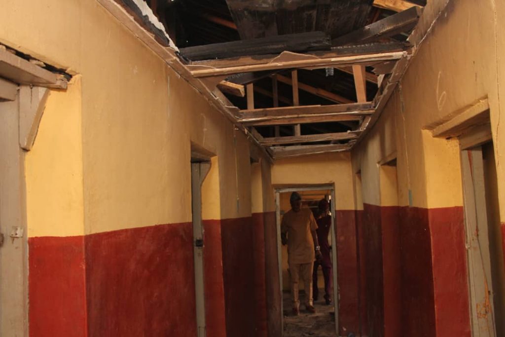 Dr Adeniran assessing the affected building