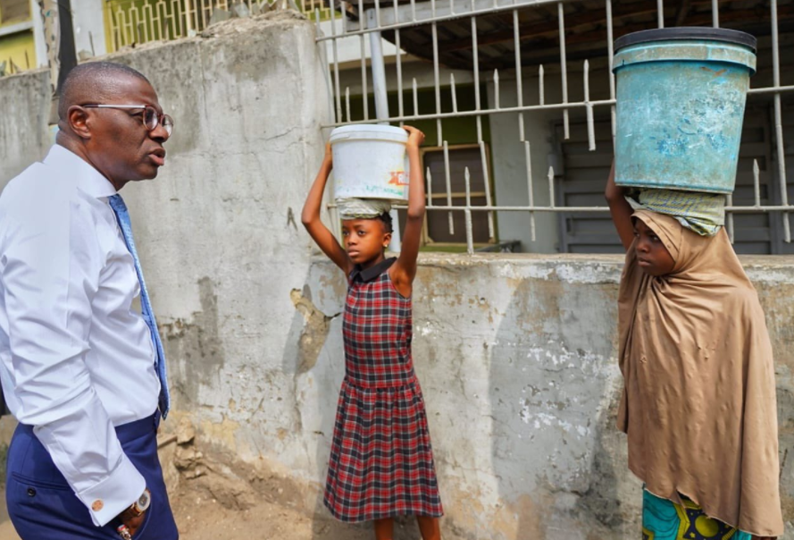 Sanwo Olu offers scholarships to two girls running errands during school hours
