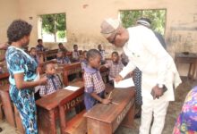 Dr. Adeniran at SDA Primary School, Old-Ife road during the monitoring exercise.