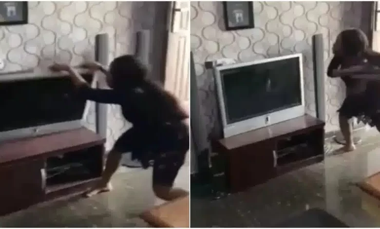 lady destroys boyfriend’s TV for allegedly cheating