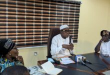 Dr. Adeniran (middle) flanked by Full Time Member, Hon. Akeem Oladeji (right), and the Coord. Director, Mrs. Ladipo during the briefing
