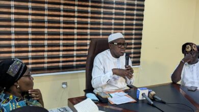 Dr. Adeniran (middle) flanked by Full Time Member, Hon. Akeem Oladeji (right), and the Coord. Director, Mrs. Ladipo during the briefing