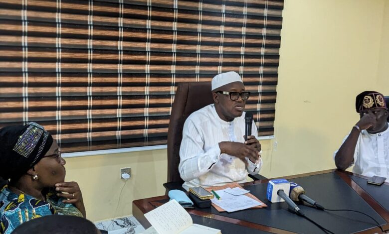 Dr. Adeniran (middle) flanked by Full Time Member, Hon. Akeem Oladeji (right), and the Coord. Director, Mrs. Ladipo during the briefing