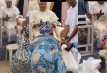 Elderly women seen kneeling before wealthy woman